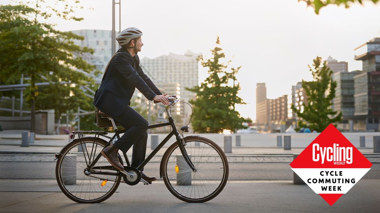 Image shows a man cycle commuting to work to reap the benefits.