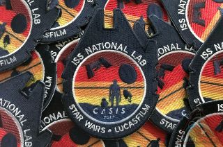 Mission patches represent the science aboard the U.S. National Laboratory launched aboard a SpaceX Dragon spacecraft to the International Space Station on Dec. 15, 2017. The patches are the result of a partnership between Lucasfilm and the Center for the Advancement of Science in Space (CASIS).