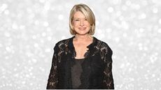 Martha Stewart in a black sweater on a glitzy silver holiday-looking background