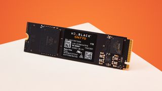 A WD_Black SN770 SSD on an orange background