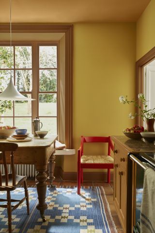 dining room with yellow yellow and orange ceiling