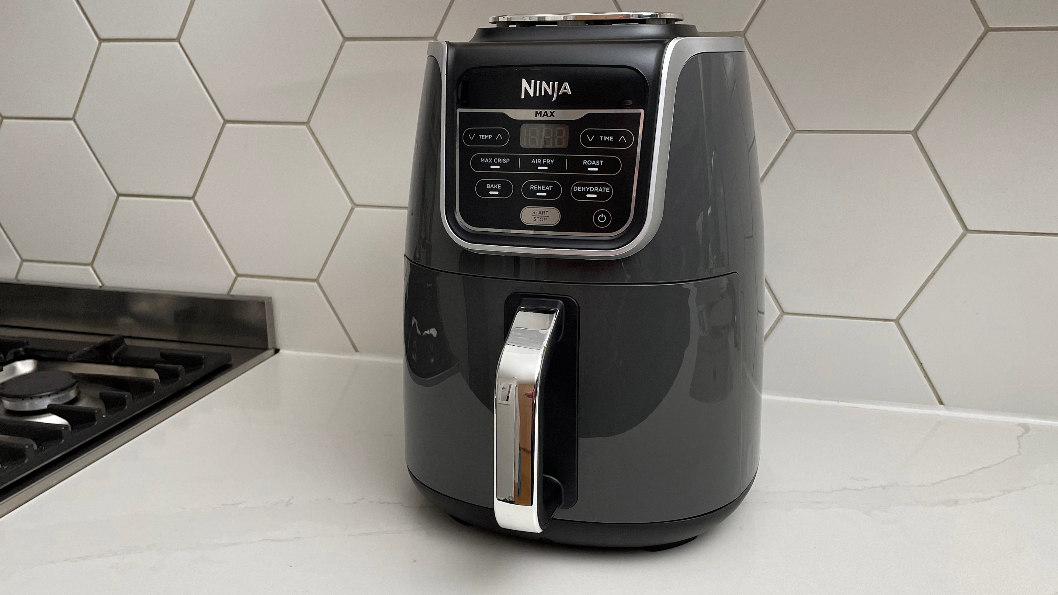The Ninja Air Fryer Max AF160 is on a kitchen countertop