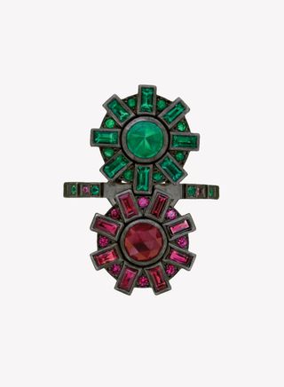 Ruby and emerald cogs ring against a white background.