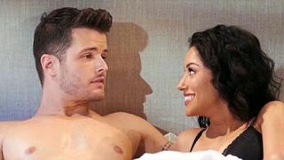 Michael Mealor and Zuleyka Silver as Kyle and Audra in bed in The Young and the Restless