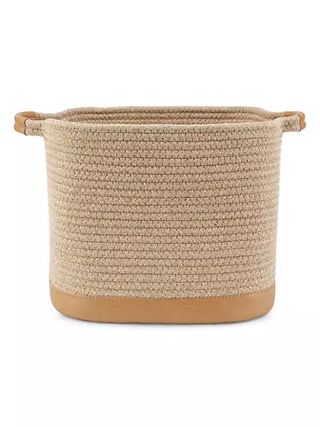 A neutral colored square storage basket on a white background