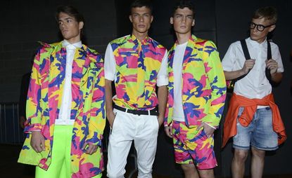 Male models wearing brightly coloured outfits