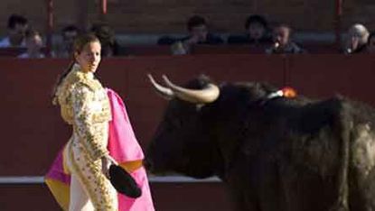 Spanish bullfighter Ana Infante and a bull