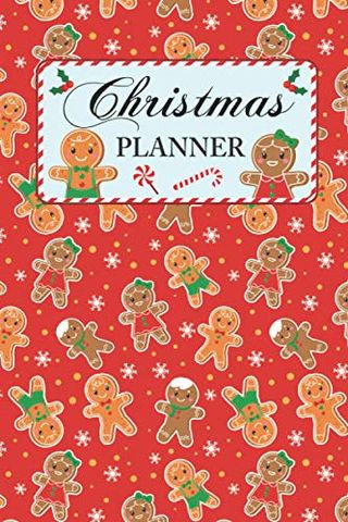 A red notebook with gingerbread on the front, the words 'Christmas planner' in decorative writing