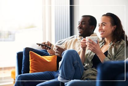 Couple on the sofa watching their TV