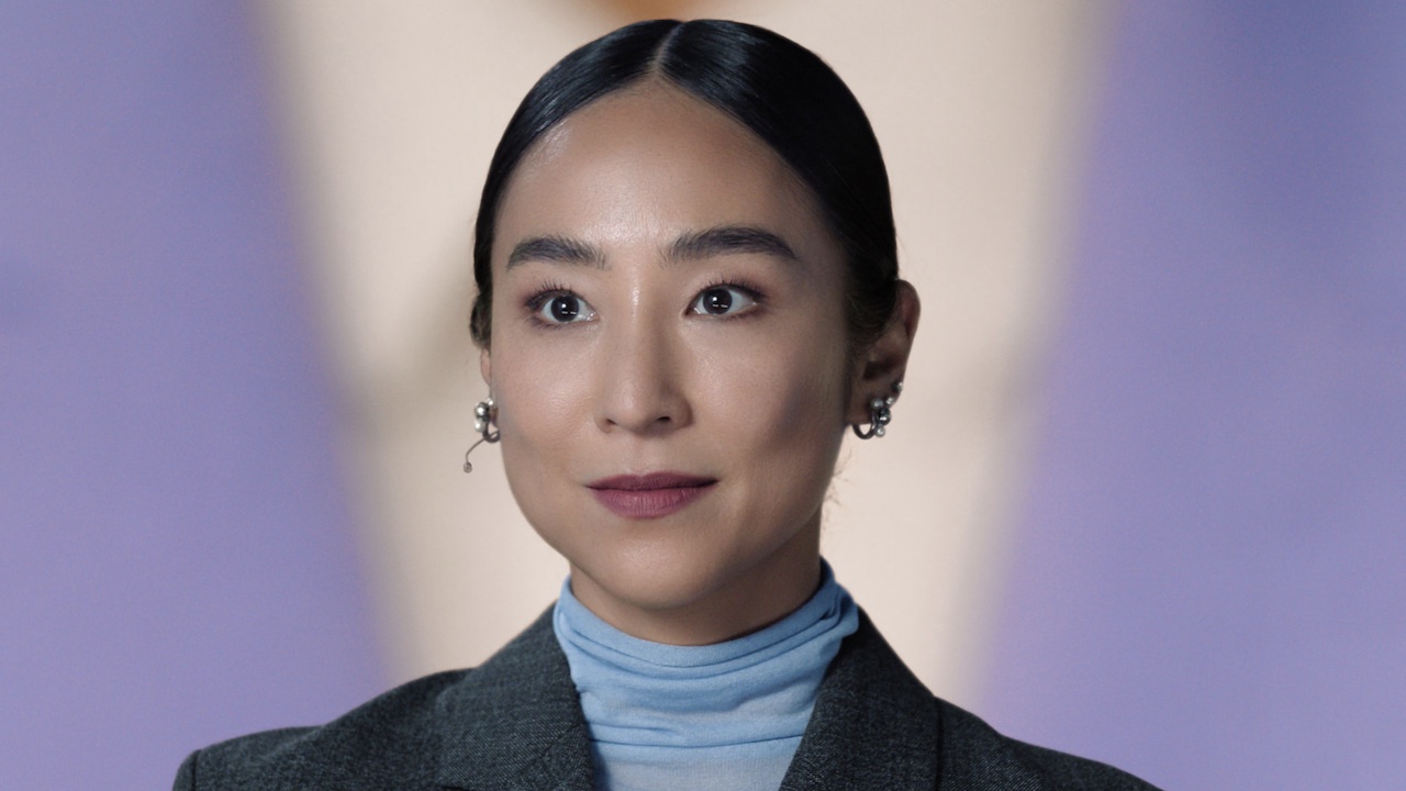 Greta Lee in The Morning Show attempting to present her AI model.