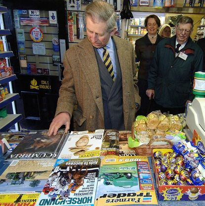 Prince Charles browsing magazines