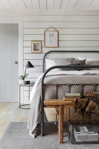 Rustic bedroom idea by Amara, with shiplap paneling and neutral color theme