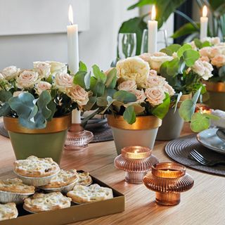 Flower centrepieces on decorated dining table