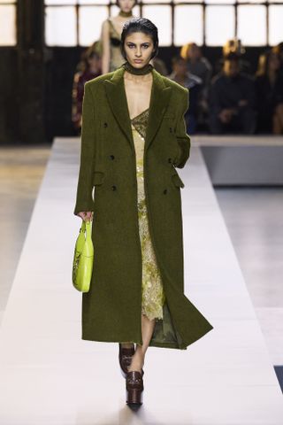 Woman on Gucci Runway wearing green