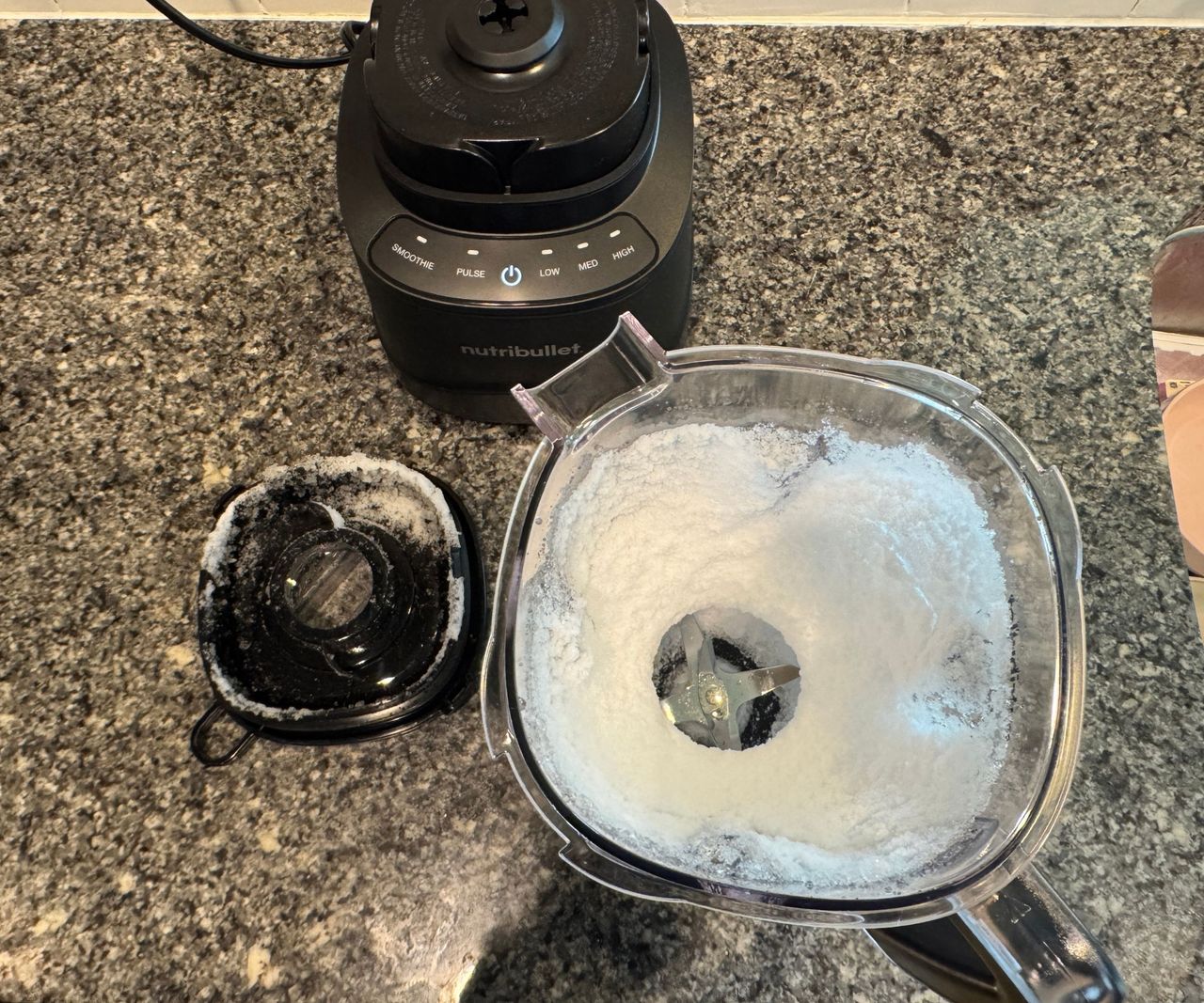 Crushed ice inside a blender pitcher.