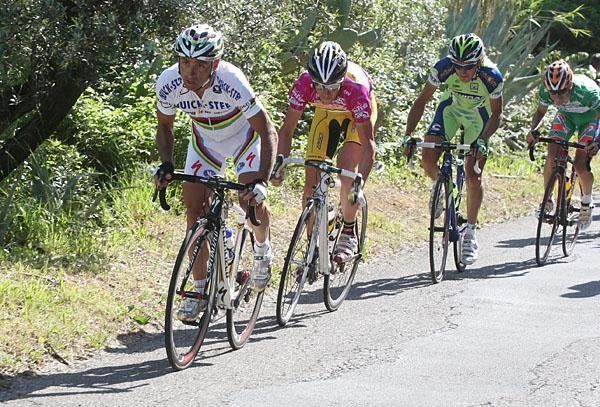Bettini leads a small chasing group on the final climb of the day.