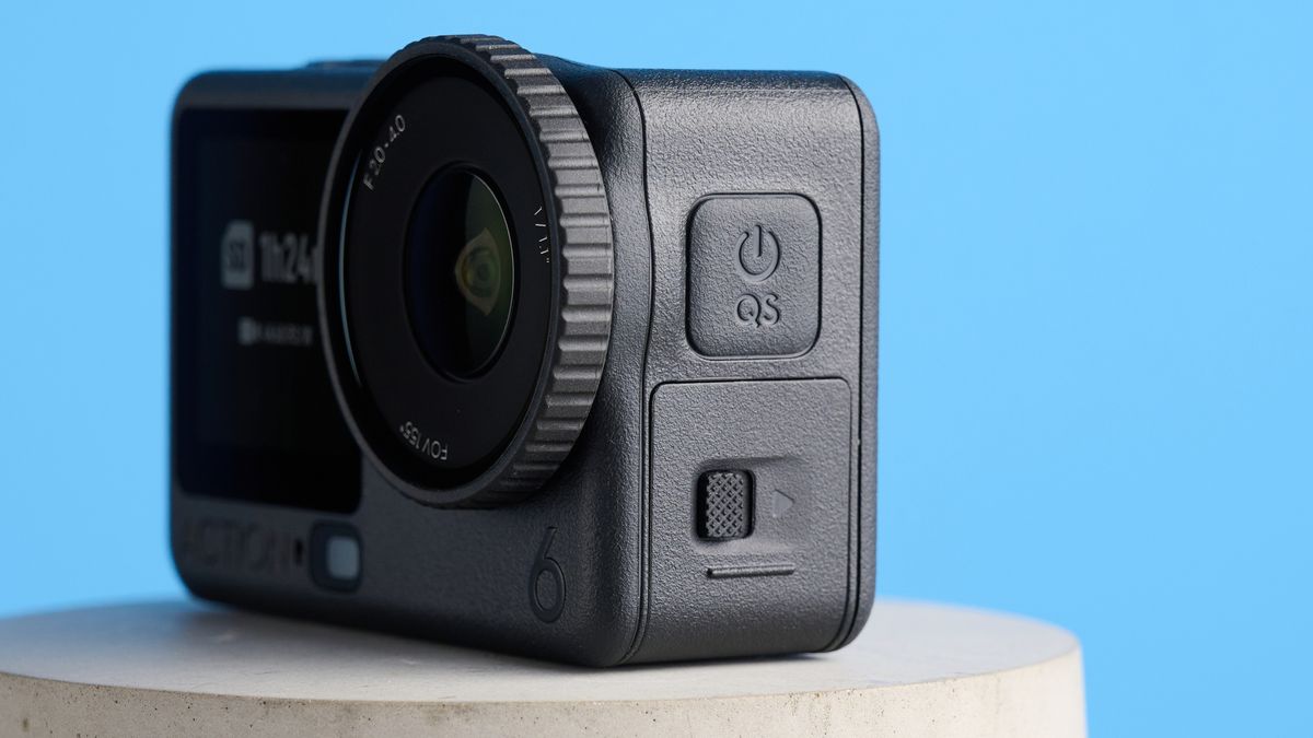 The DJI Osmo Action 6 on a stone surface with a blue background