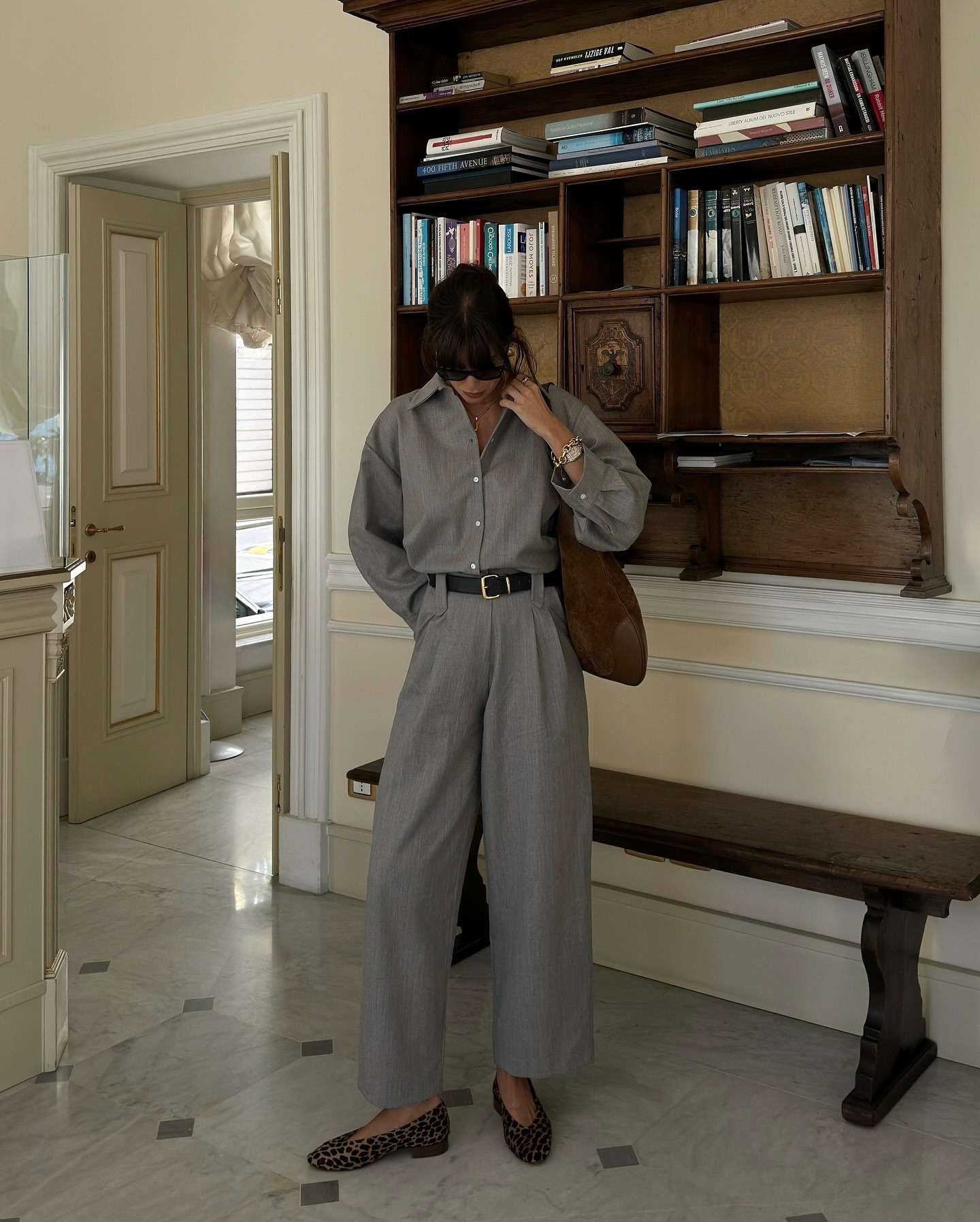 Influencer Julie wears a grey trouser and button-up set.
