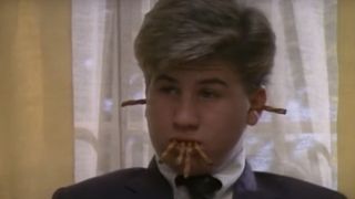 Jason Hervey as Wayne Arnold with pretzels in his mouth and ears on The Wonder Years