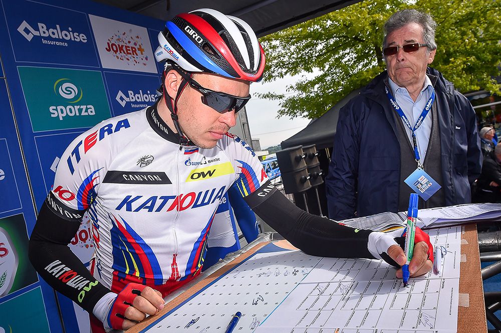 Riders sign in before the final stage in Belgium.