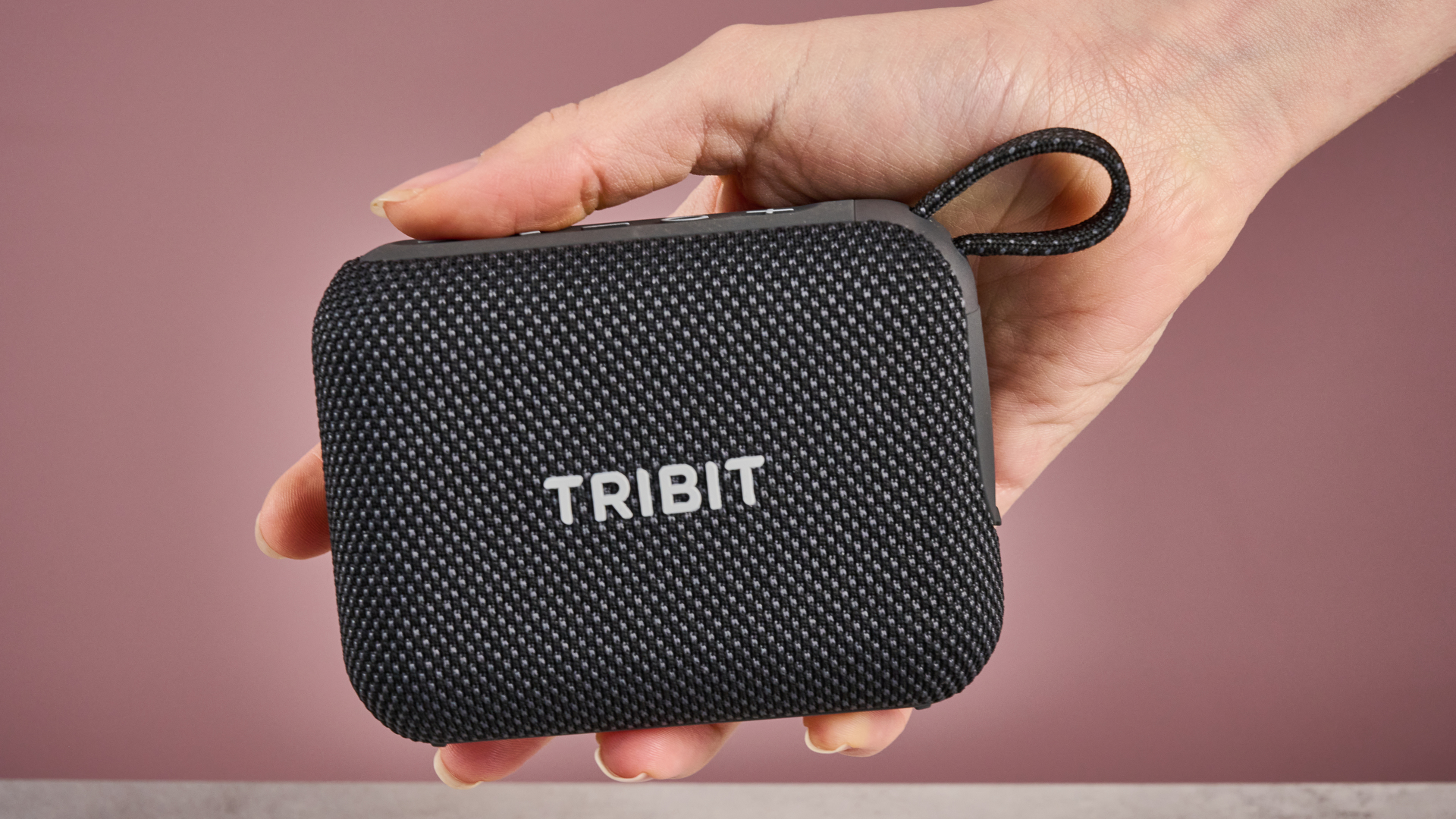 Tribit PocketGo in someone's hand