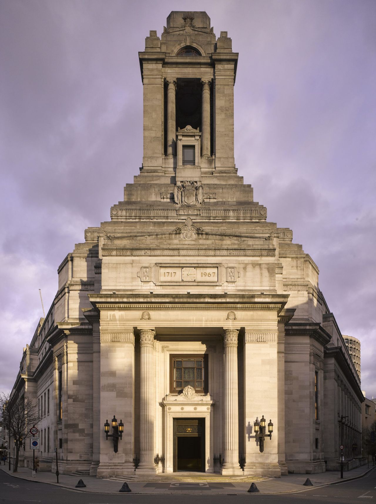 The entrance pylon at the corner of the building. It forms a war memorial and resembles other contemporary stuctures, such as the old Port of London Building