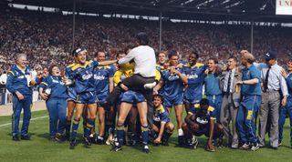 LONDON, UNITED KINGDOM - MAY 14: Wimbledon players celebrate with manager Bobby Gould (c) after beating Liverpool 1-0 in the 1988 FA Cup Final at Wembley Stadium on May 14, 1988 in London, England. (Photo by David Cannon/Allsport/Getty Images)
