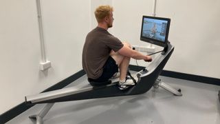 Fitness reviewer Harry Bullmore working hard to put a rowing machine through its paces
