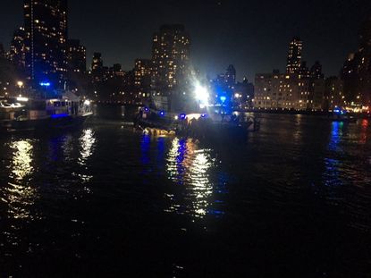 The scene of Sunday night's helicopter crash in New York City.