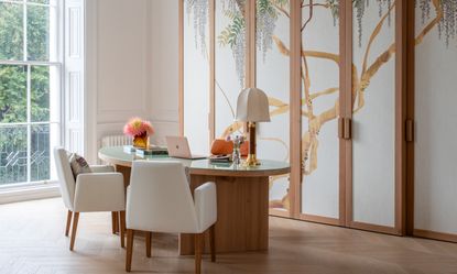 Office space with cupboards fronted by a nature mural