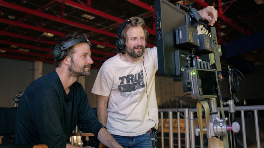 A behind-the-scenes image of Matt and Ross Duffer looking at a TV monitor while filming Stranger Things season 5