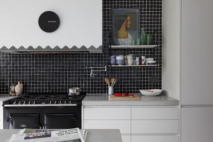 A kitchen backsplash with small shelves