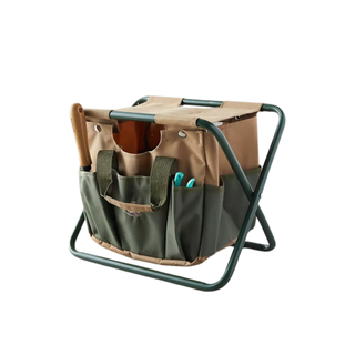 A brown and green canvas carry-all gardening stool