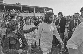 George Best plays a match for Dunstable Town in 1974.