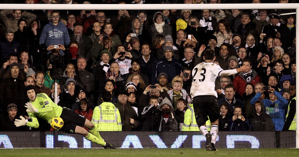 Petr Cech of Chelsea saves a penalty from Clint Dempsey of Fulham during the Barclays Premier League match between Fulham and Chelsea at Craven Cottage on February 14, 2011 in London, England.