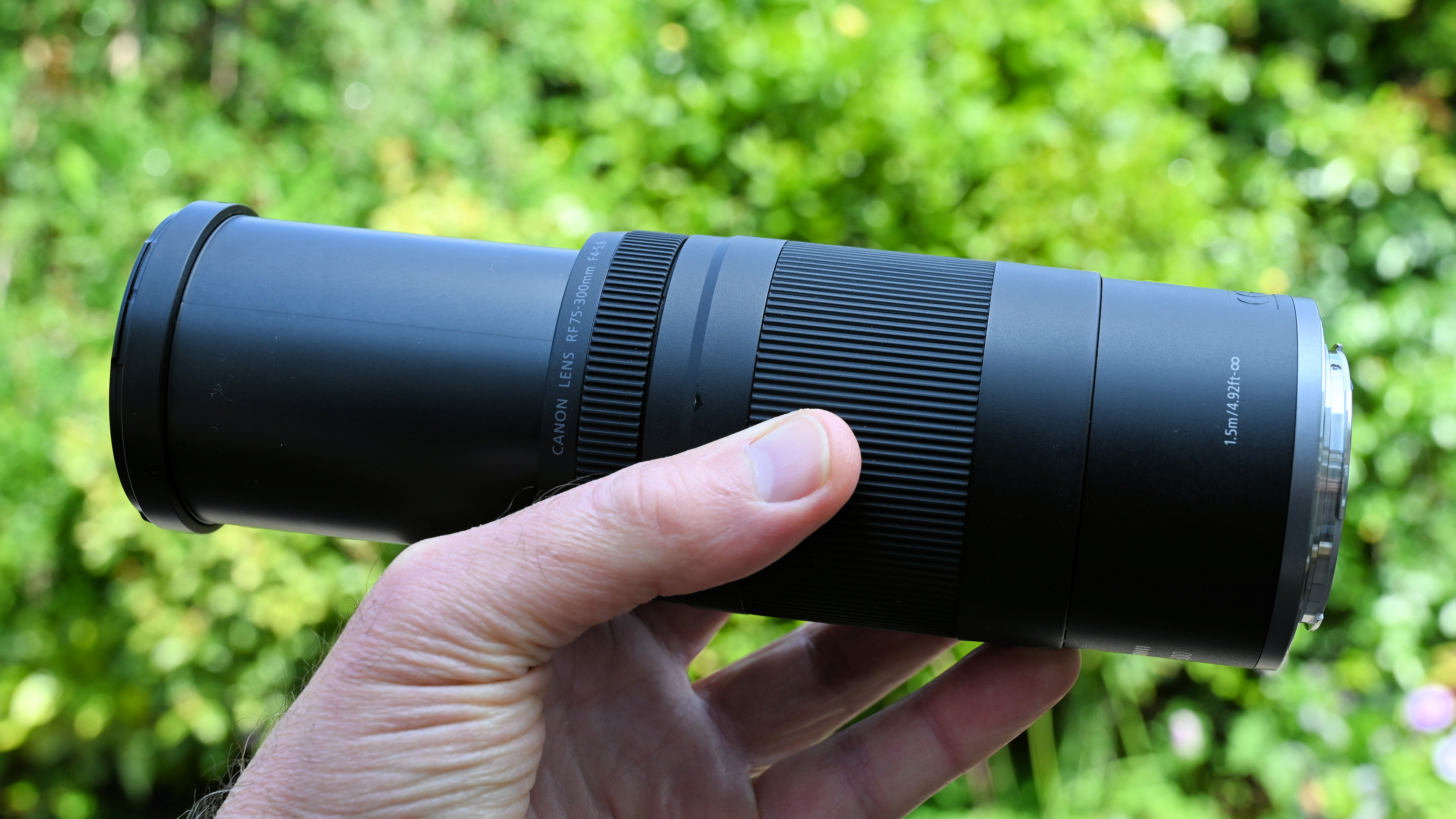 Canon RF 75-300mm f/4-5.6 product shot held in hand