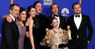 David Heyman, Shannon McIntosh, Margaret Qualley, Quentin Tarantino, Brad Pitt, Julia Butters, and Leonardo DiCaprio pose in the press room with award for Best Motion Picture — Musical or Comedy during the 77th Annual Golden Globe Awards at The Beverly Hilton Hotel on January 05, 2020 in Beverly Hills, California.