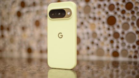Google Pixel 10 in Lemongrass against a bubbly backsplash