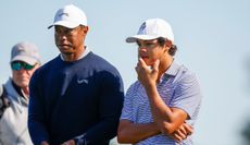 Tiger and Charlie Woods look on