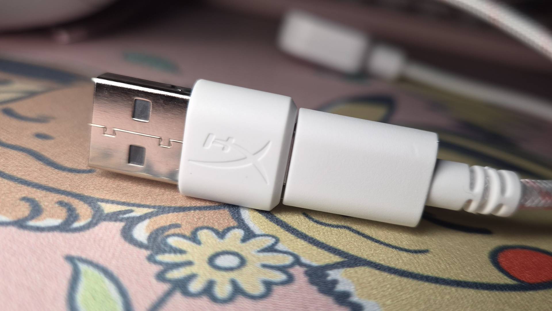 Photo of the USB cable for the White-Pink HyperX Cloud III wired gaming headset.