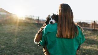 Woman holding dog