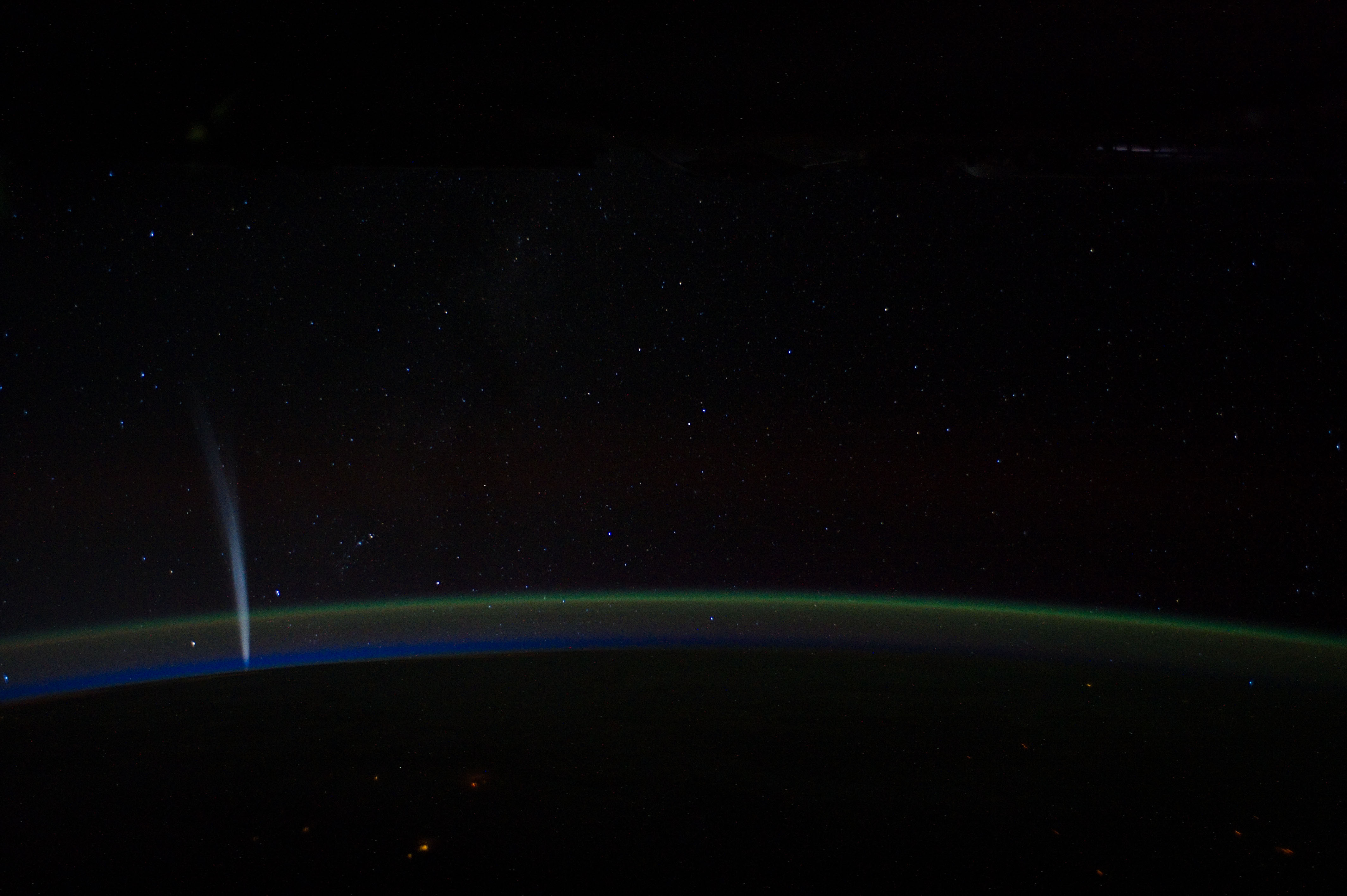 Comet Lovejoy is visible near Earth&amp;rsquo;s horizon in this nighttime image photographed by NASA astronaut Dan Burbank, Expedition 30 commander, onboard the International Space Station on Dec. 21, 2011.