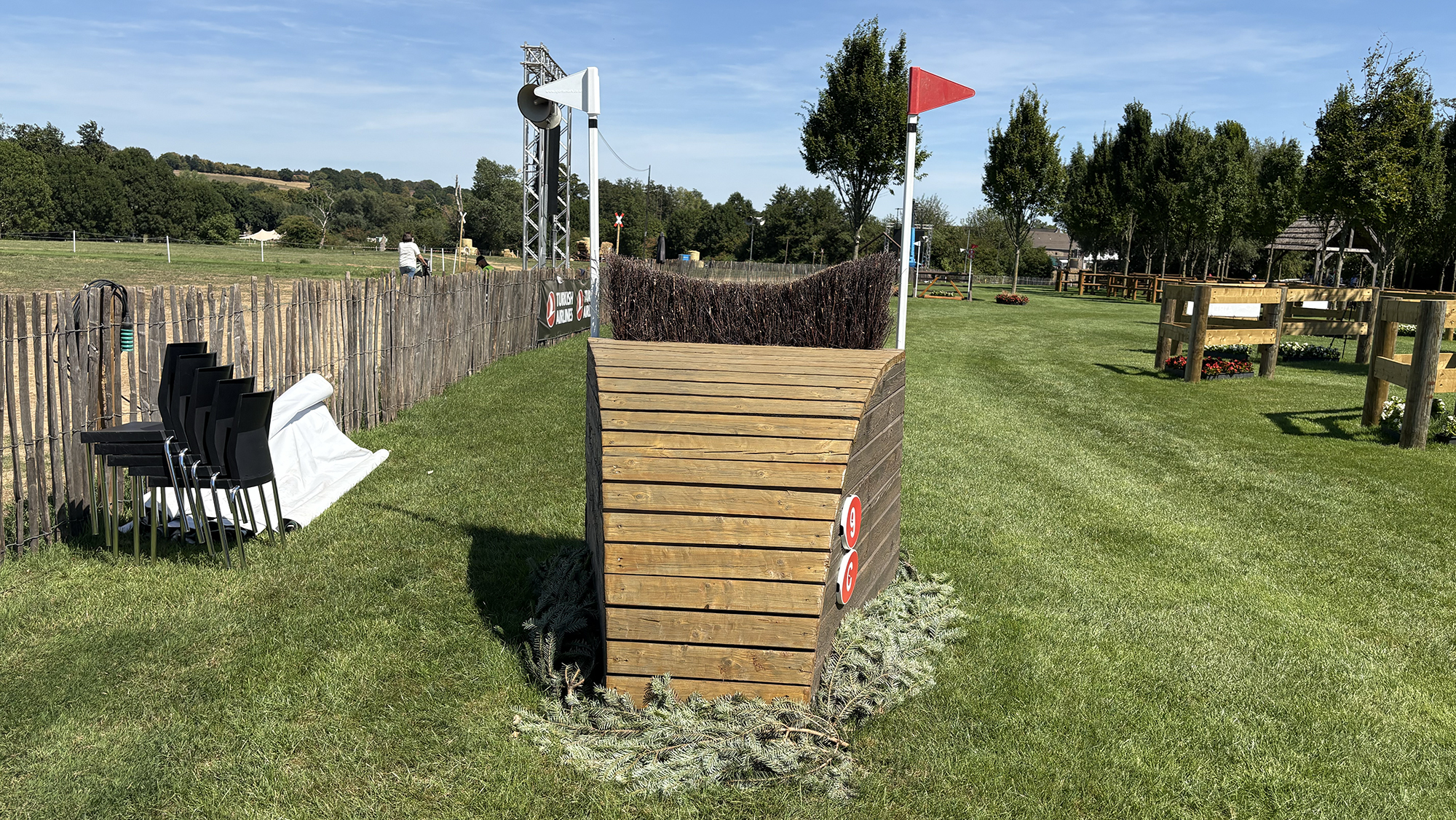 A narrow fence made of wood and topped with brush on the Aachen eventing World Championships cross-country course