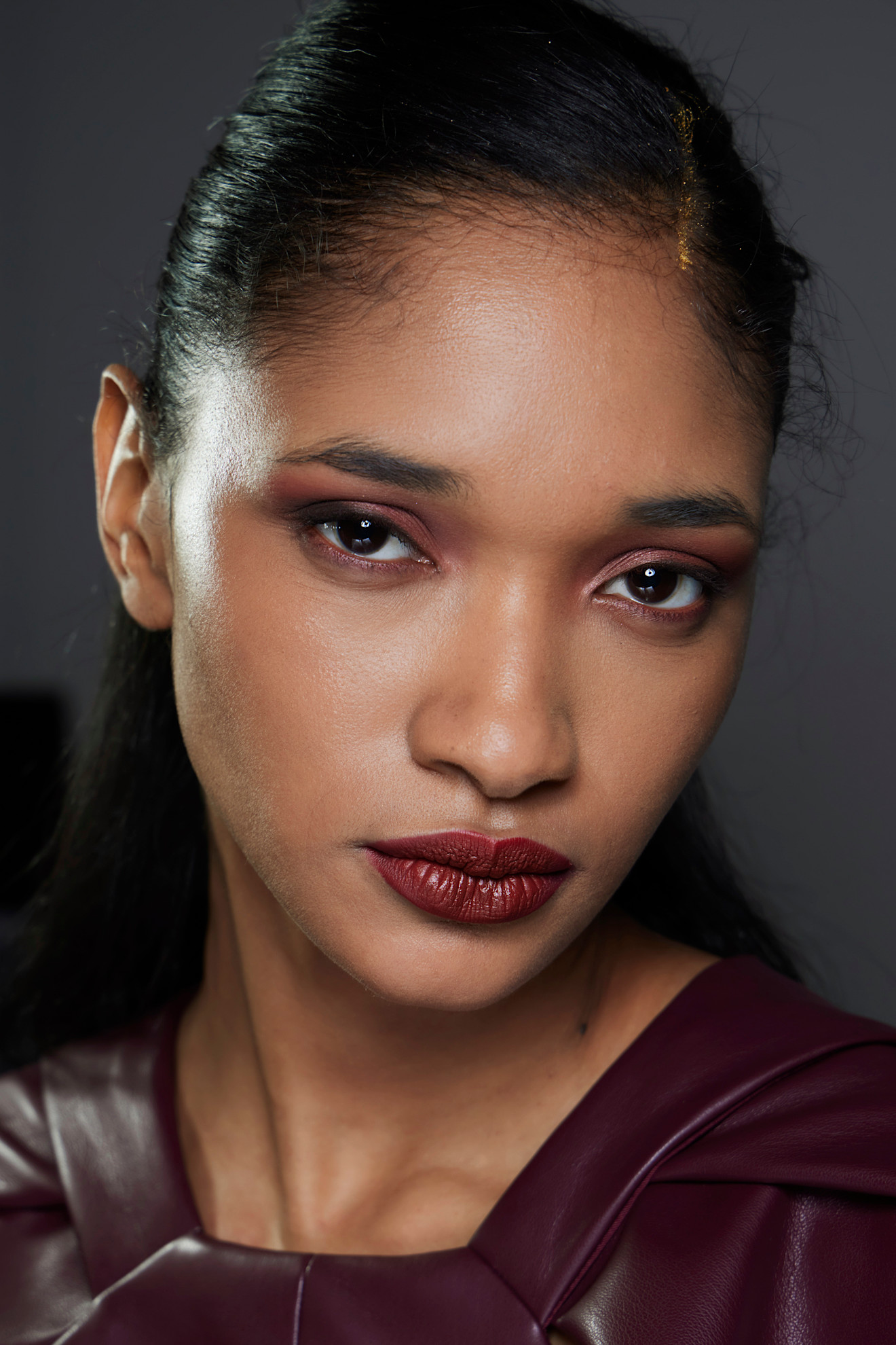 Mohapatra bks F23 001 model with a complementary burgundy lip and eye