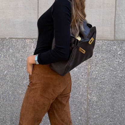An image of a woman wearing new fall arrivals to shop 2026