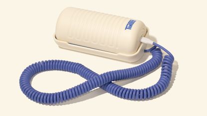 A product image of the viral Tin Can WiFi-enabled landline phone in a blue and white colorway