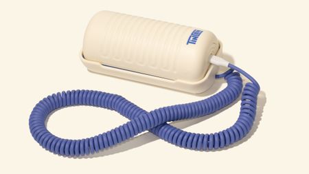 A product image of the viral Tin Can WiFi-enabled landline phone in a blue and white colorway