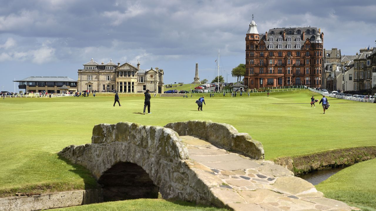 The 18th hole at St Andrews with The R&amp;A clubhouse in the background and Swilcan Bridge in the foreground