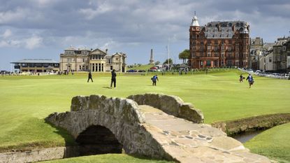 The 18th hole at St Andrews with The R&A clubhouse in the background and Swilcan Bridge in the foreground