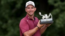 Lusas Herbert holding LIV Golf UK trophy